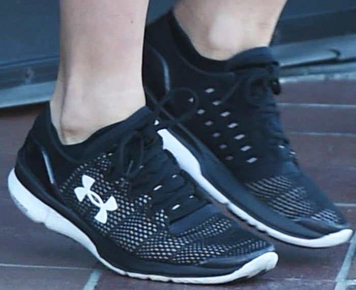 Julianne leads a workout session in Under Armour Apollo 2 sneakers