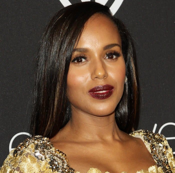 Kerry Washington completes her glamorous look with deep burgundy lips and sparkling stud earrings