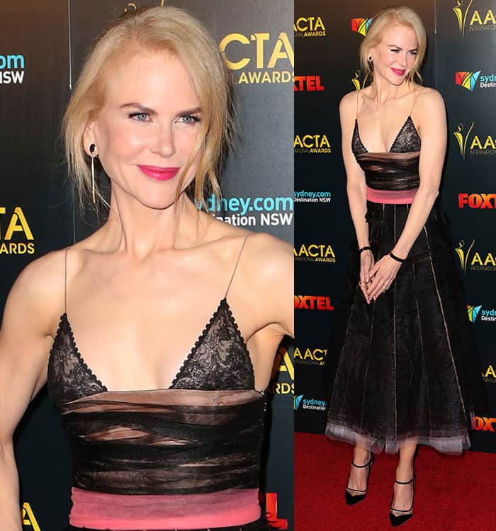 Nicole Kidman dazzles in a gothic-inspired Rochas dress featuring a lace bodice, sheer tulle panels, and a contrasting pink waistband