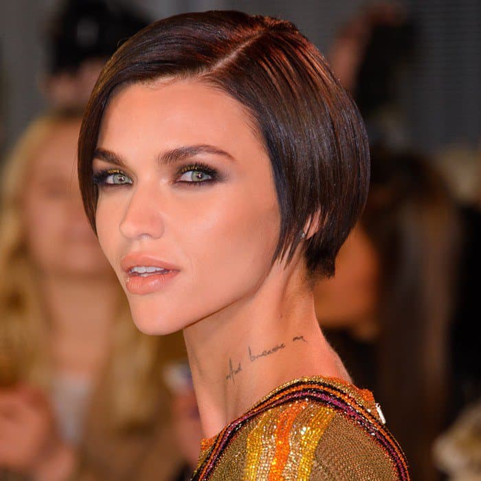 Ruby Rose complemented her edgy look with shimmering eyeshadow, a soft peachy lip, and a sleek bob
