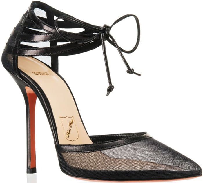 A side view highlights the Soebedar “Charissa” pump’s sheer mesh upper, sharply pointed toe, and lace-up ankle ties balanced on a slender stiletto heel