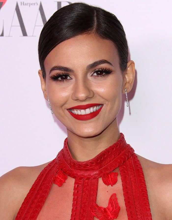 Victoria Justice's side-parted bun and red lipstick