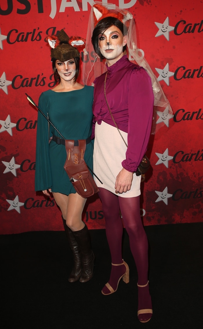Ashley Greene dresses as Robin Hood alongside her hairstylist Joseph Chase, who dons a playful fox costume, at the 2018 Just Jared Halloween Party