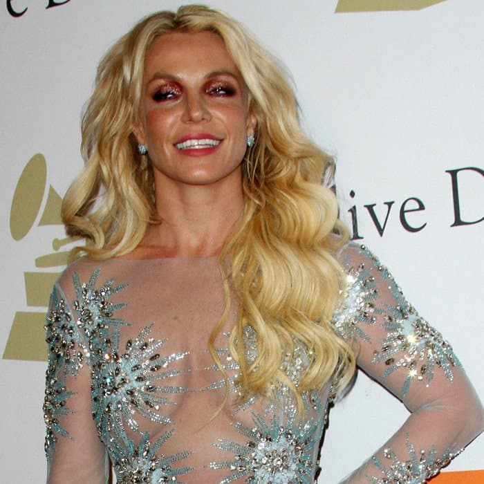 Britney Spears wears a daring sheer embellished gown by Brazilian designer Uel Camilo at Clive Davis’ 2017 Pre-Grammy Gala, making a bold red carpet statement