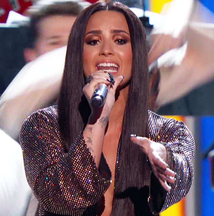 Demi performs "Staying Alive" as part of the Bee Gees tribute