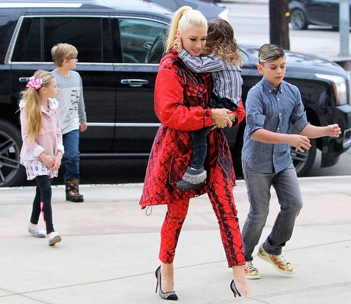 Stefani balances family duties and fashion, stepping out in coordinated Moschino separates and black cap-toe pumps while accompanying her children to church