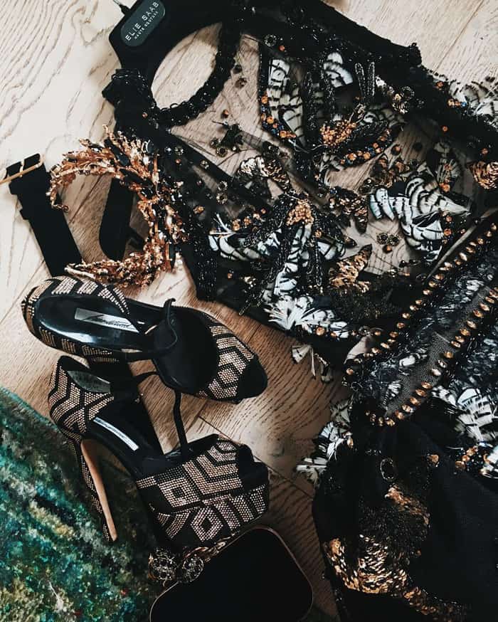 A close-up look at Janelle Monáe's stunning Elie Saab gown paired with geometric patterned platform heels, showcasing the intricate craftsmanship and bold accessories