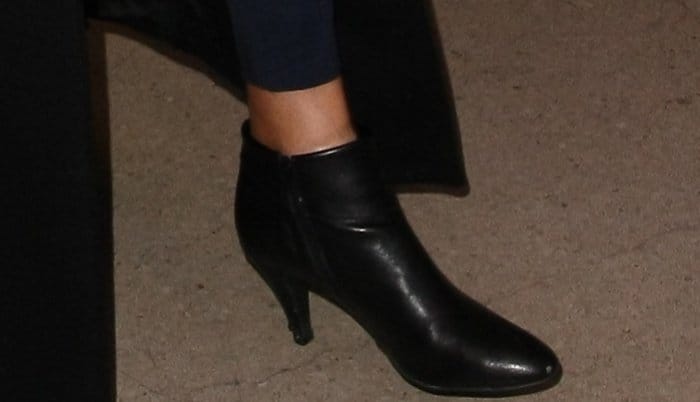 Caitlyn Jenner's sleek black leather ankle boots with a modest heel offer a classic and polished finish