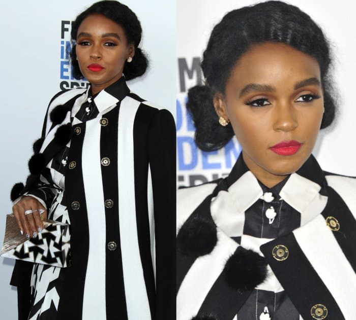 Janelle Monáe completed her bold monochrome look with flawless matte skin, defined brows, a striking red lip, and soft, smoky eyes