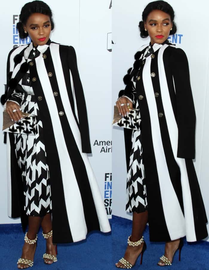 Elevate your monochrome game by pairing bold black-and-white patterns with a structured coat, statement heels like Janelle Monáe’s Christian Louboutin "Tudor Bal" sandals, and a geometric clutch for a strikingly sophisticated look
