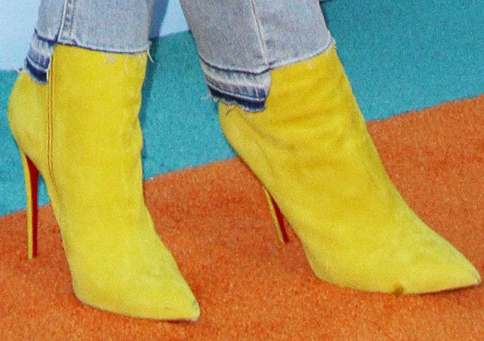 Blac Chyna adds mustard-yellow Christian Louboutin So Kate boots to a white shirt and distressed jeans outfit
