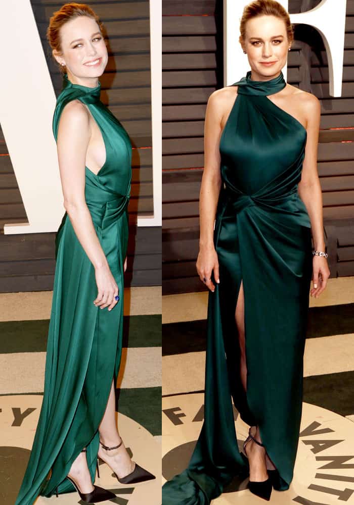 Brie Larson stuns in an emerald green Ralph Russo gown with a high slit and elegant draping at the 2017 Vanity Fair Oscar Party, paired with black satin pumps and Neil Lane jewelry