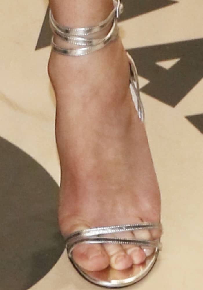 Diane brings on the shine in a pair of metallic Jimmy Choo "Tizzy" sandals