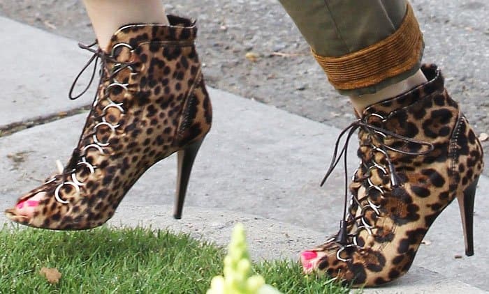 The Brian Atwood Adele booties combine ponyhair leopard print, lace-up detailing, and peep toes for a bold take on animal-print footwear