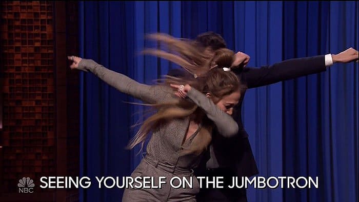 Jennifer Lopez dabbing with Jimmy Fallon during their dance battle