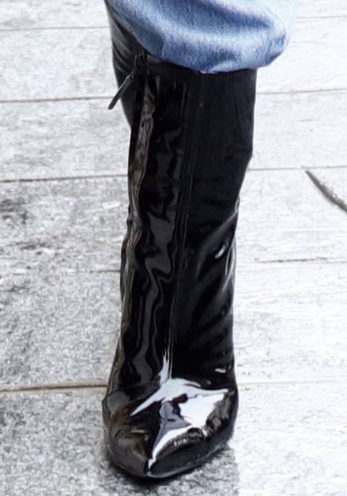 Kendall Jenner steps out in style wearing sleek pointed-toe patent leather boots