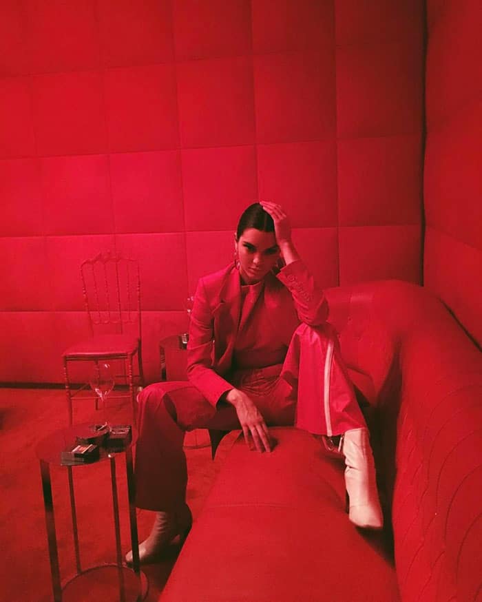 Back in Los Angeles, Kendall restyles the same Kurt Geiger boots with a monochrome red suit, proving their versatility beyond Fashion Week