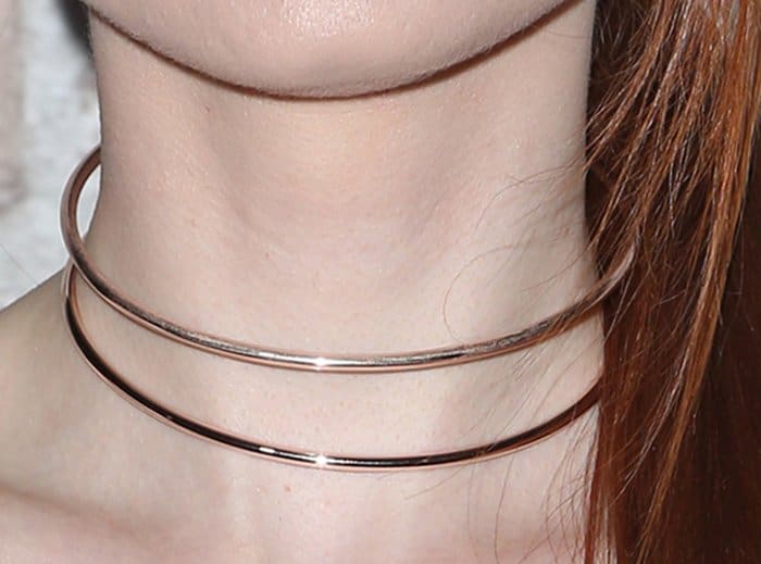 A pair of slim rose-gold chokers added a modern touch to the actress’s understated evening ensemble