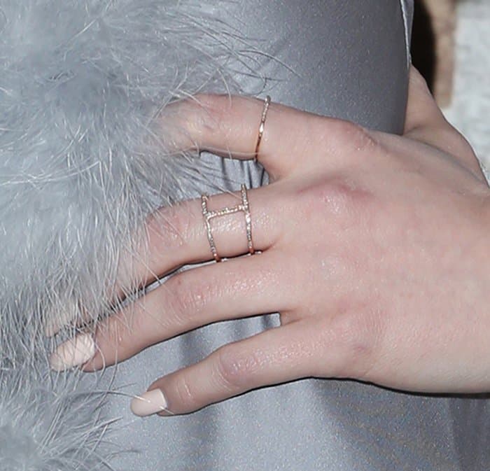 Madelaine Petsch accessorized her look with delicate rose-gold stackable rings, including a geometric openwork design that echoed the modern elegance of her shimmering silver ensemble
