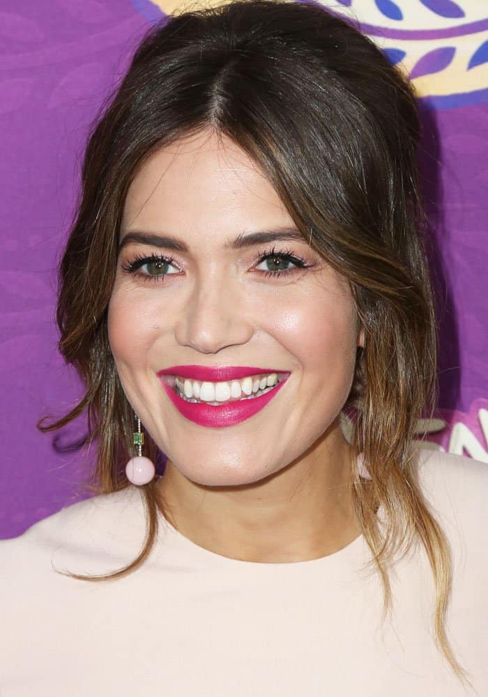 Mandy Moore radiates elegance with soft, tousled waves and a romantic updo, complementing her fresh pink lipstick and glowing complexion at Disney's 'Tangled Before Ever After' screening in Los Angeles on March 4, 2017