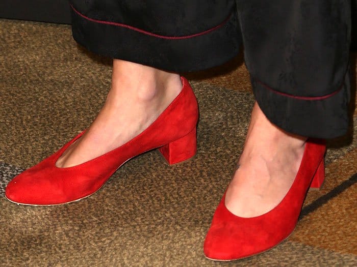 Close-up of Melissa Benoist’s bold red Mansur Gavriel suede pumps with low block heels, adding a vibrant pop of color to her pajama-inspired PaleyFest look