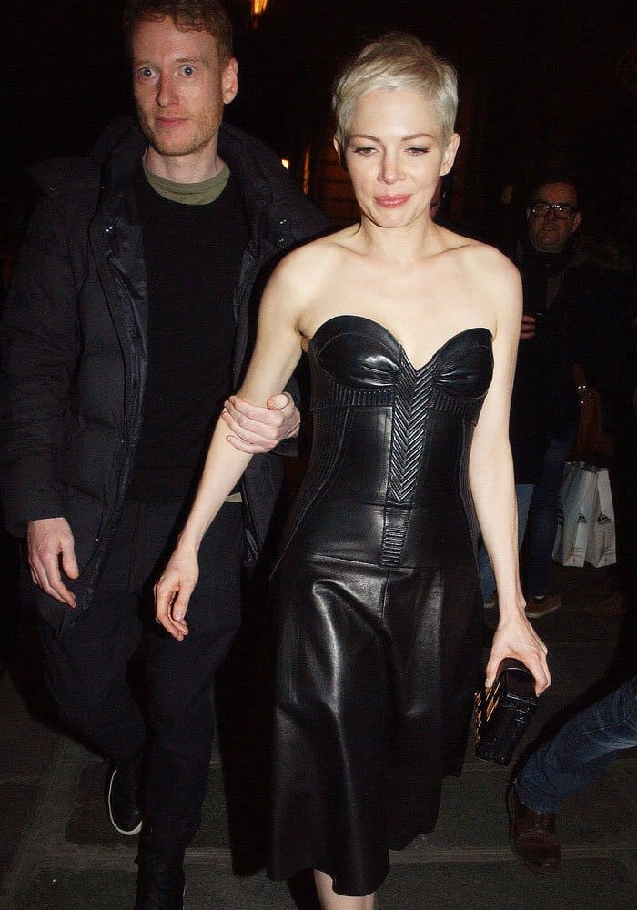After the Louis Vuitton show, Michelle stepped out for dinner with a friend, still rocking her bold all-leather ensemble