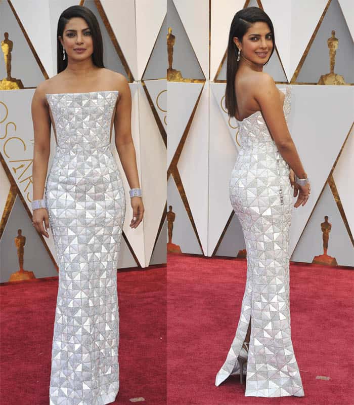 Priyanka Chopra turns heads in a stunning geometric-patterned Ralph Russo gown, showcasing structured elegance with a sleek strapless silhouette and impeccable detailing