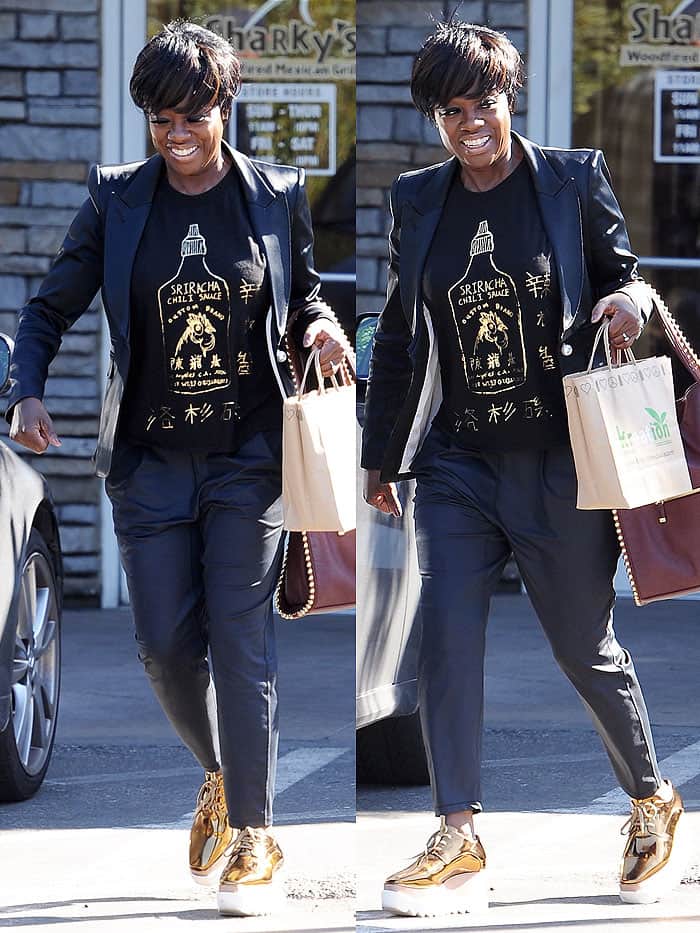 Oscar winner Viola Davis smiling for the paparazzi after grabbing takeout at Sharky's Mexican restaurant in Los Angeles, California, on March 1, 2017