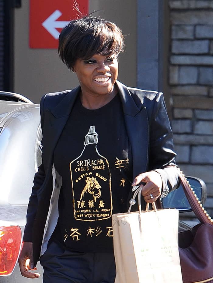 Viola Davis’ standout Sriracha chili sauce graphic tee adds a playful, bold touch to her monochrome outfit