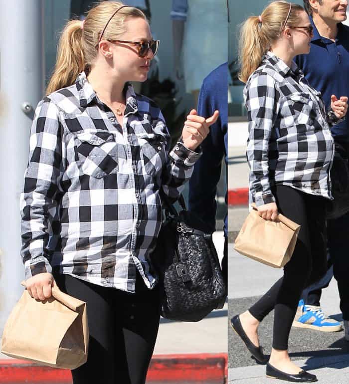 Amanda Seyfried opts for cozy maternity wear in a black-and-white checkered shirt, Seraphine leggings, and black ballet flats while out for lunch in Los Angeles
