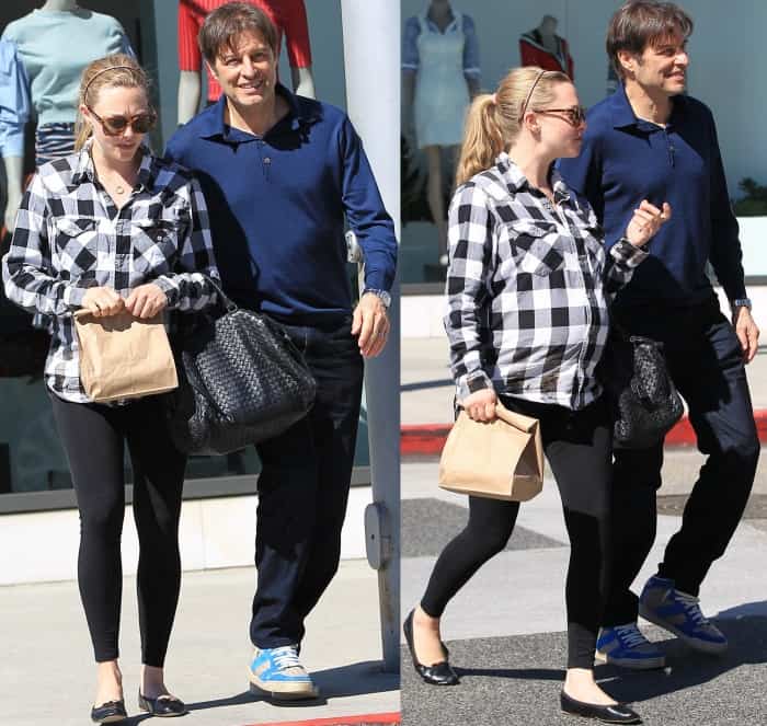 Amanda Seyfried steps out with Thomas Sadoski in effortless off-duty maternity style, wearing a Brandit check shirt, Seraphine overbump leggings, Saint Laurent SL 93 sunglasses, and a Bottega Veneta Intrecciato tote