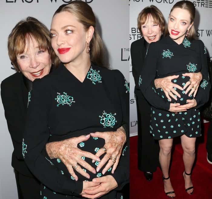 Shirley MacLaine lovingly cradles Amanda Seyfried’s baby bump on the red carpet