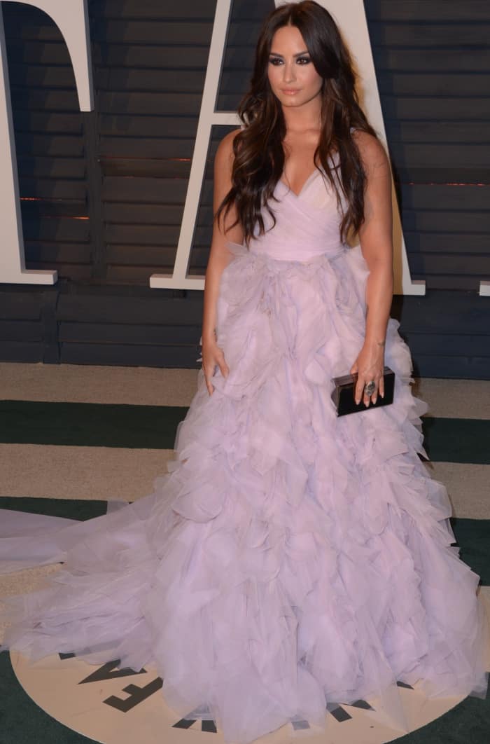 Demi Lovato looked like a fairytale vision at the 2017 Vanity Fair Oscar Party in a voluminous lilac Monique Lhuillier gown, complete with an elegant ruffle skirt and flowing train