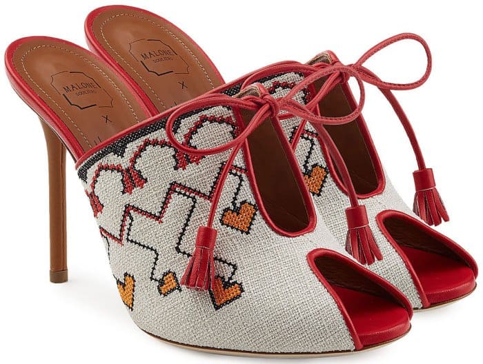 The side perspective of the Malone Souliers x Natalia Vodianova linen mules showcases the intricate construction and the harmonious blend of fuchsia and burnt orange leather, highlighting the meticulous attention to detail and design