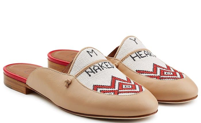 Crafted with ivory leather and featuring an embroidered linen front, these Malone Souliers x Natalia Vodianova “Neva” slippers beautifully reference the Naked Heart Foundation, blending luxury with philanthropy