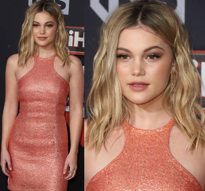 The halter neckline and molten texture catch the light from every angle, while softly tousled waves and warm-toned makeup keep the look youthful and polished