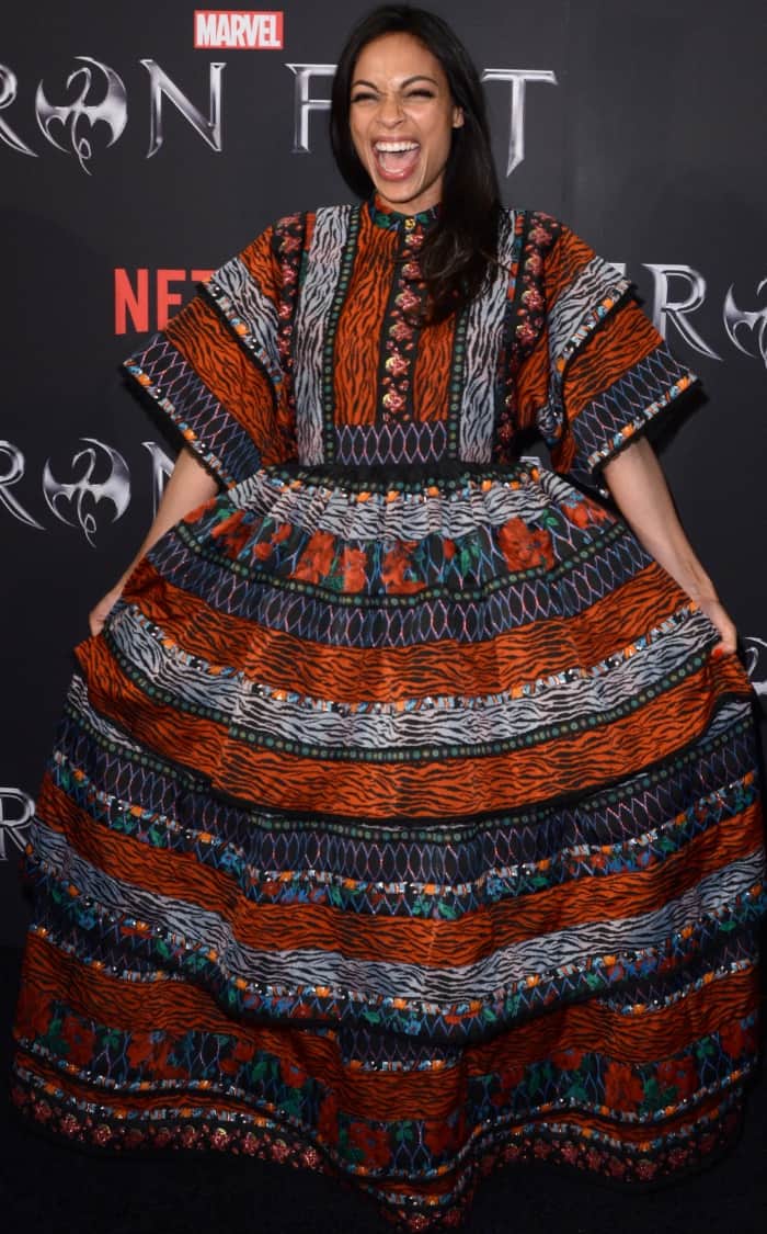 Rosario Dawson radiates joy in a bold Kenzo x HM patterned maxi dress at the Iron Fist New York screening, embracing its voluminous silhouette with playful confidence