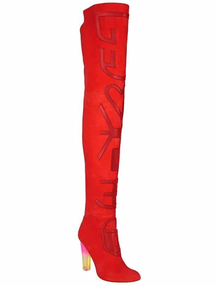 A clean product-style view emphasizes the boots’ elongated proportions, graphic surface detailing, and architectural heel design
