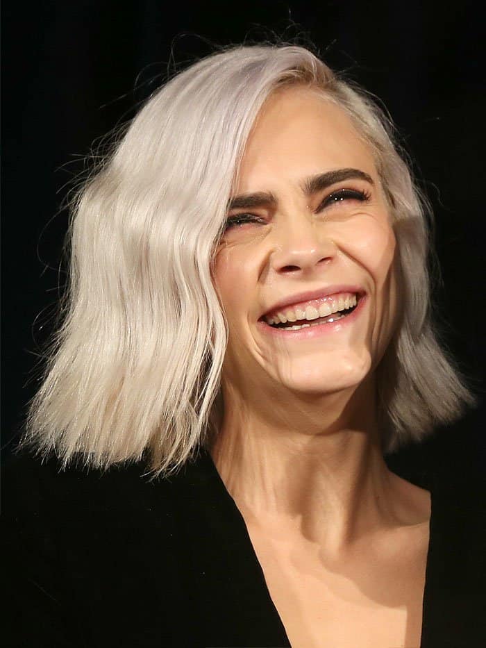Cara Delevingne flashes a subtle smile at the 4th annual unite4:humanity gala