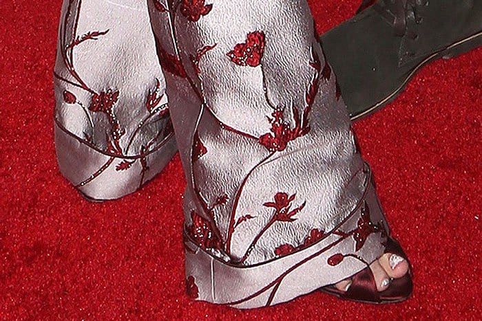 Giambattista Valli Fall 2013 patent-and-satin belted-strap sandals peeping out from the hem of Jaime King's Johanna Ortiz Jacinta jacquard pants