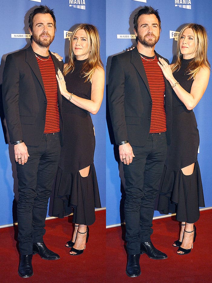 Jennifer Aniston softened her edgy Givenchy cutout skirt with minimalist black “Matilda” sandals, while Justin Theroux kept things rock-and-roll in skinny black tailoring and Chelsea boots at the Series Mania Festival in Paris