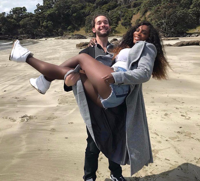 Serena Williams is lifted by her boyfriend Alexis Ohanian during a fun beach day