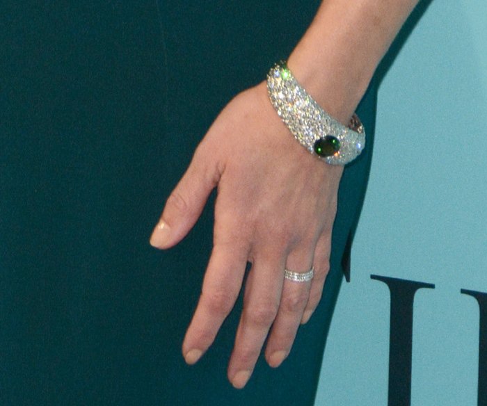 Reese Witherspoon showcased a dazzling Tiffany Co. diamond cuff bracelet, highlighted by a striking emerald centerpiece, at the Blue Book Gala
