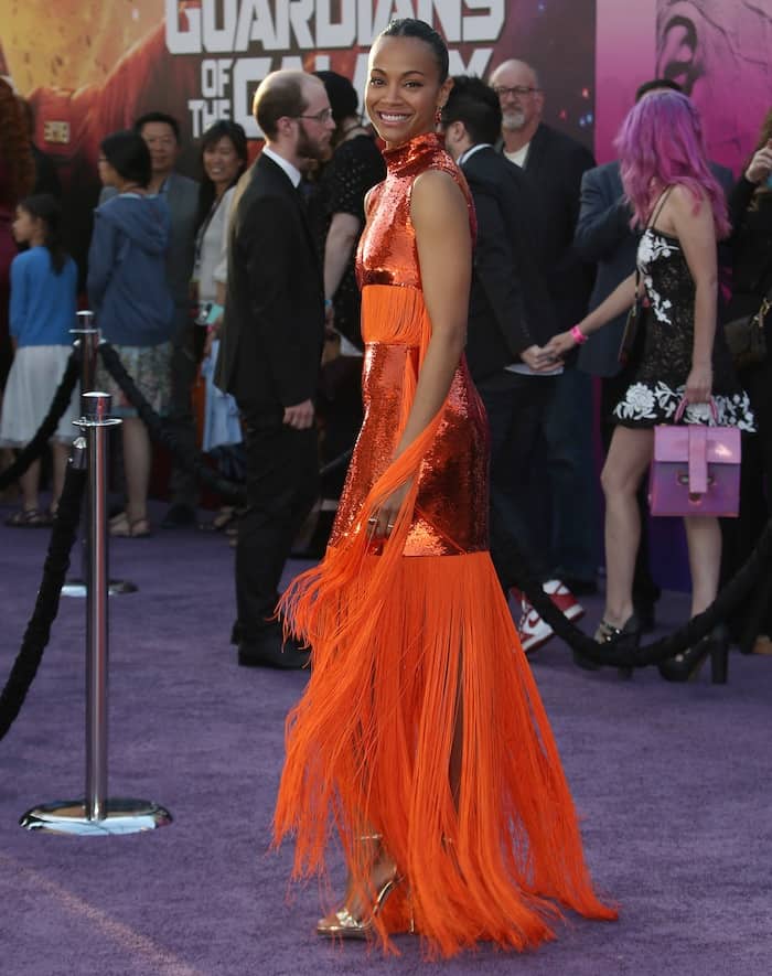 Zoe Saldaña strikes a pose, showing off the dramatic fringe and shimmer of her Emilio Pucci gown