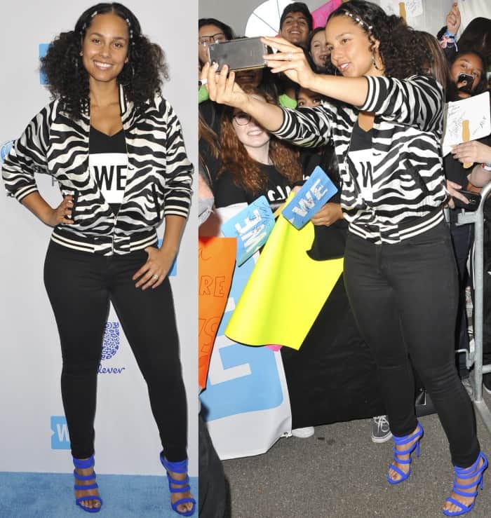 Alicia Keys in a zebra-print bomber jacket, black pants, and Giuseppe Zanotti “Chantal” electric-blue strappy sandals at WE Day 2017