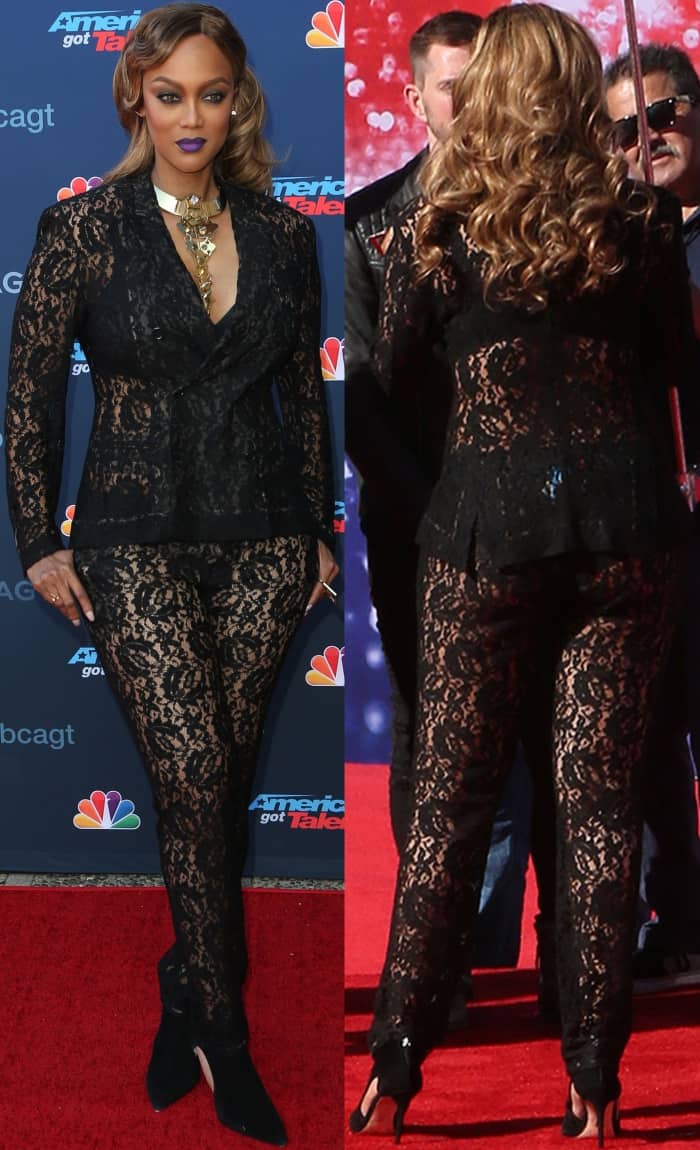 Tyra Banks showcases her sheer black lace suit from every angle, revealing the intricate patterning and her black pointed-toe high-heel booties as she moves along the AGT red carpet