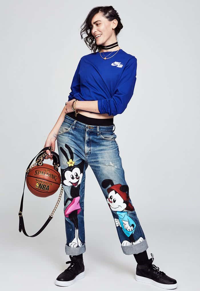 Artist and designer Andrea Bergart showcases her signature Basketball Purse—crafted from an authentic Spalding NBA ball with a gold chain harness—blending sporty streetwear with high-fashion flair