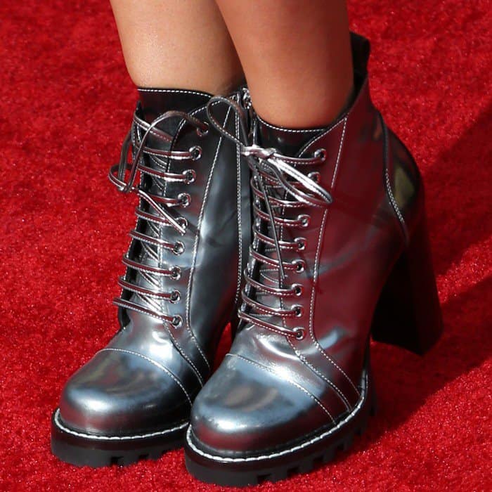 Ashley Tisdale steps up her edgy red carpet style with metallic Louis Vuitton ‘Star Trail’ ankle boots, featuring a chunky heel, rugged lug sole, and glossy finish
