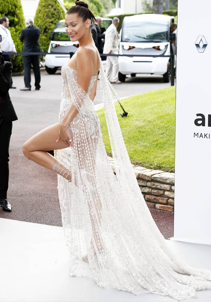 Bella Hadid dazzles in René Caovilla’s crystal-embellished wraparound sandals, elongating her legs with their sleek, strappy design at the 2017 amFAR Gala