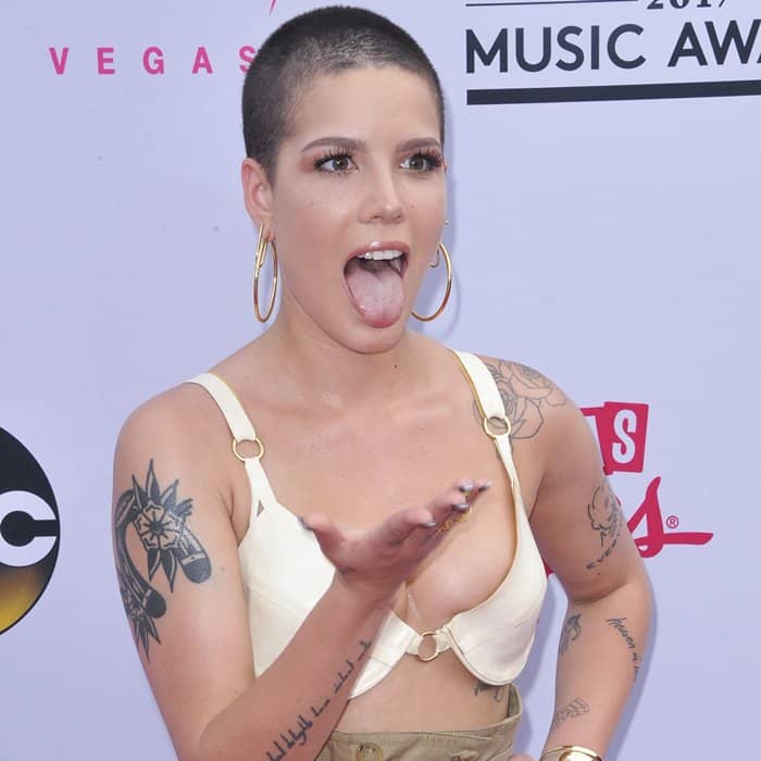 Halsey in a cream silk bra top from Sergio Hudson